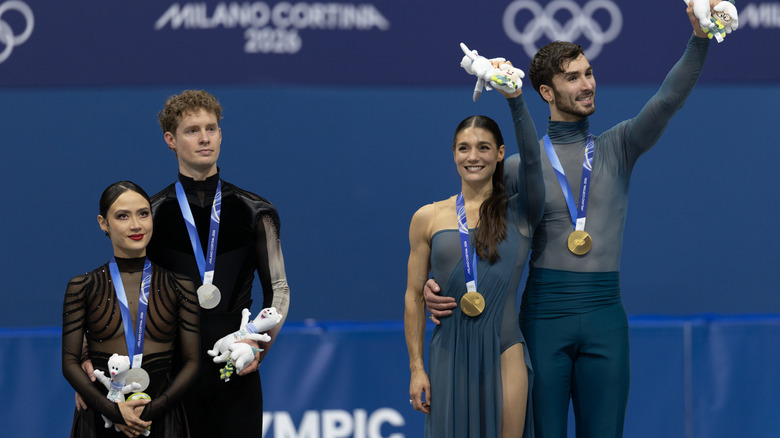 Ice dancers standing on the podium at the 2026 Olympics in Milano Cortina