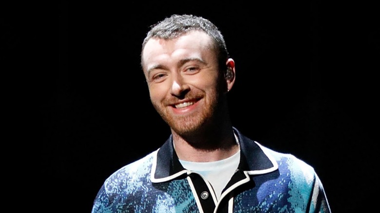 Sam Smith onstage at Madison Square Garden in 2017, smiling