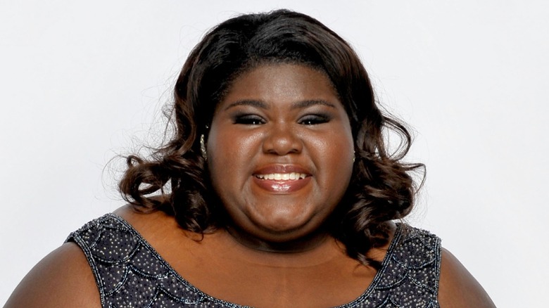 Gabourey Sidibe smiling on the red carpet in 2010