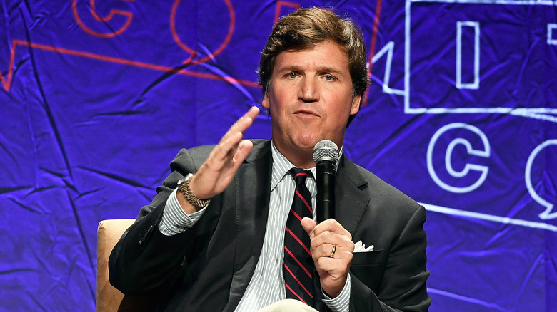 Tucker Carlson speaking at Politicon