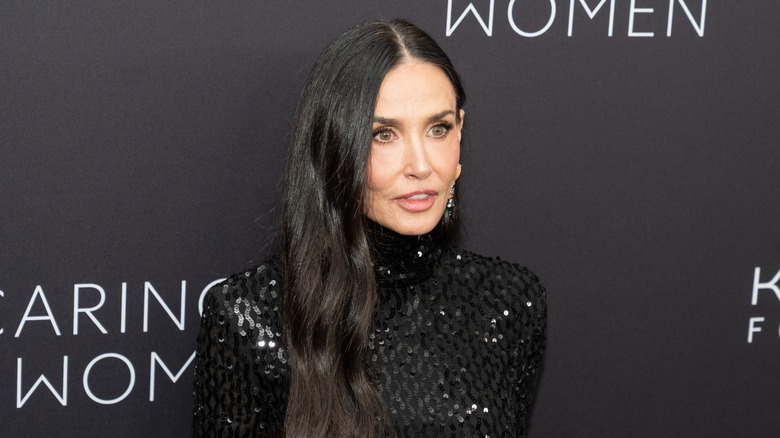 Demi Moore posing on step-and-repeat