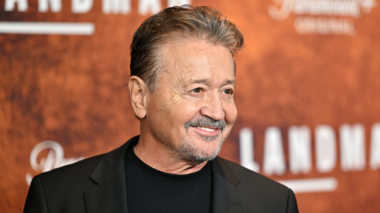 Mark Collie smiling on step-and-repeat