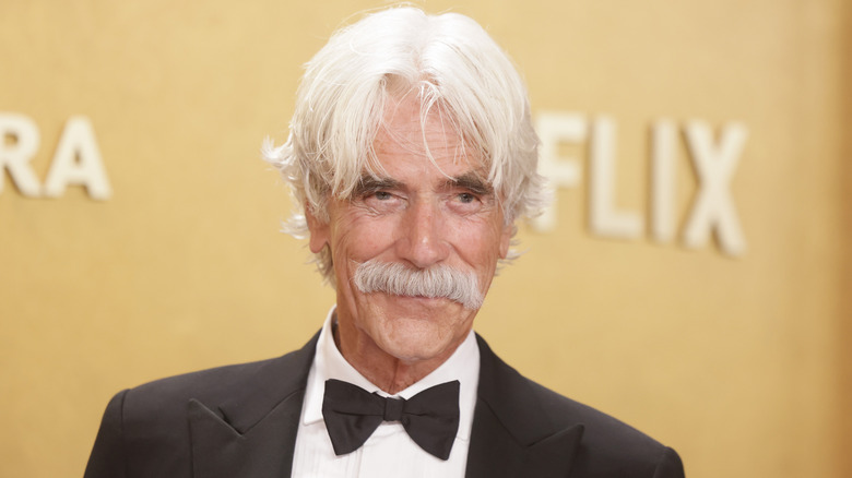 Sam Elliott posing on step-and-repeat