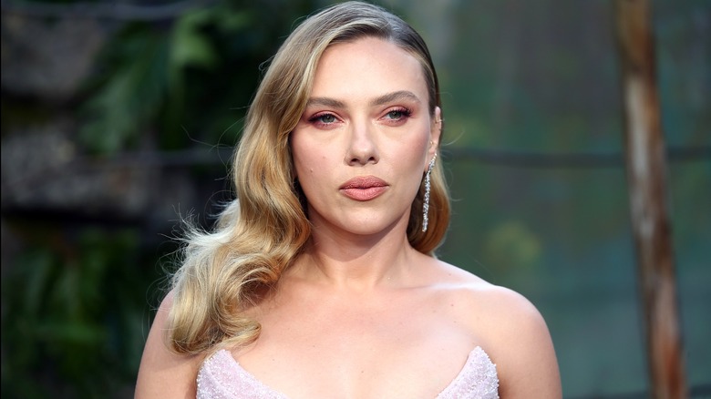 Smiling Scarlett Johansson attending the 2025 "Jurassic World Rebirth" premiere