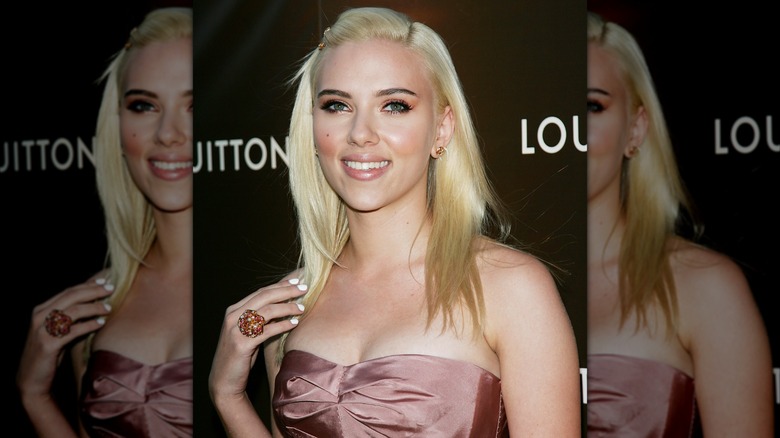 Scarlett Johansson attending a Louis Vuitton party in 2007 with platinum blonde hair