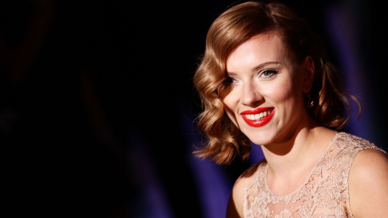 Scarlett Johansson posing at the 2012 Dolce & Gabbana Fashion Show