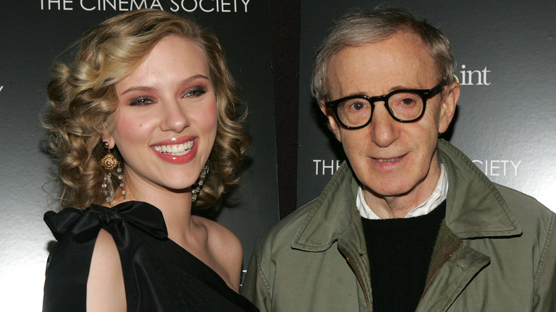 Scarlett Johansson smiling while posing with Woody Allen