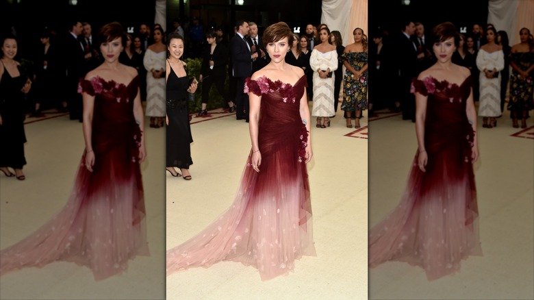 Scarlett Johansson posing for photos at the 2018 Met Gala in a Marchesa dress