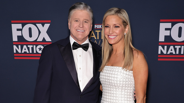 image of Sean Hannity and Ainsley Earhardt side by side on the red carpet of an event