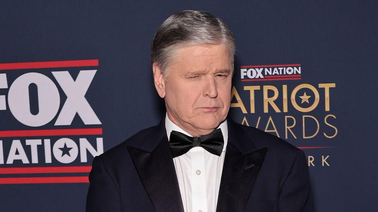 Sean Hannity staring at the camera with one eye closed