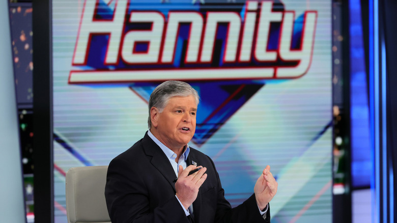 Sean Hannity speaking on his show "Hannity" while seated