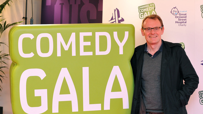Sean Lock posing at event