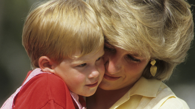 Princess Diana holding Prince Harry