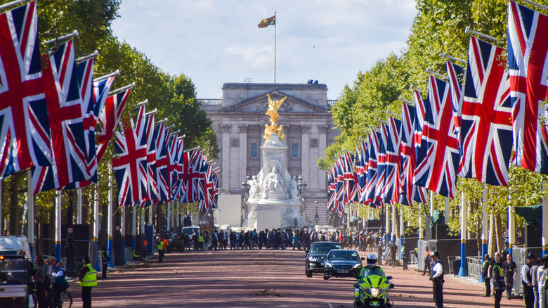Buckingham Palace lined with Union Jack flags