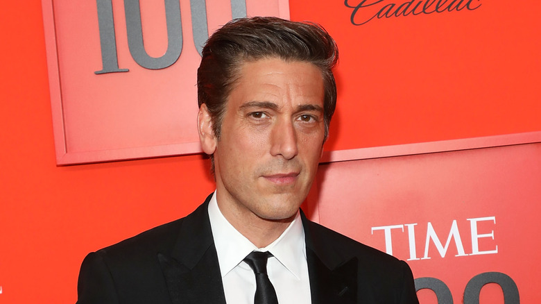 David Muir at an event in 2019 posing and smiling.