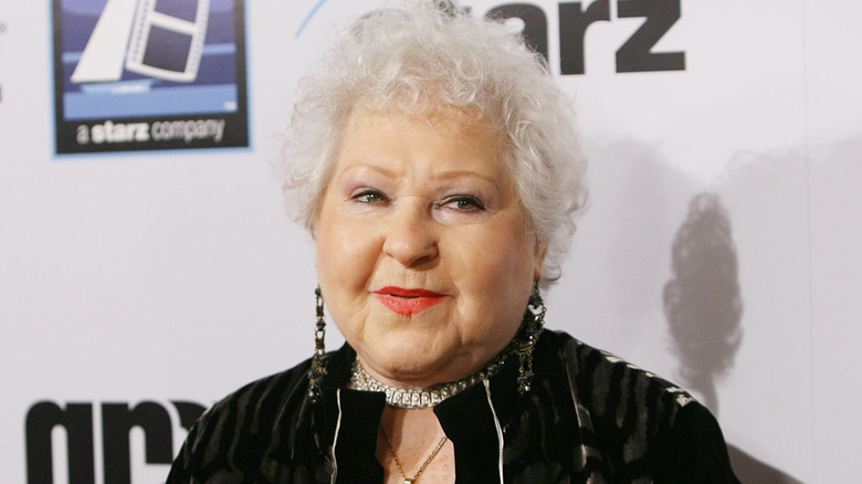 Estelle Harris in a black outfit and diamond jewelry at a Starz event in 2008