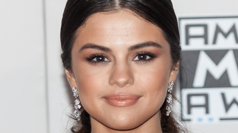 Selena Gomez smirking