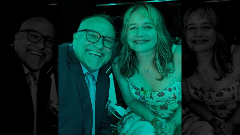David DeLuise taking a selfie with his wife, Julia DeLuise, under green lighting.