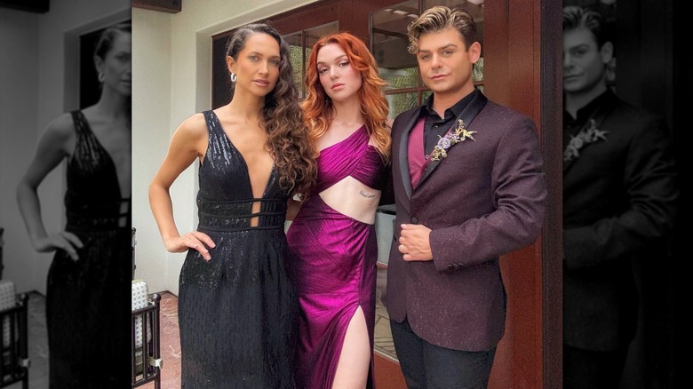 Garrett Clayton wearing his purple suit jacket beside Jennifer Stone and Maiara Walsh.