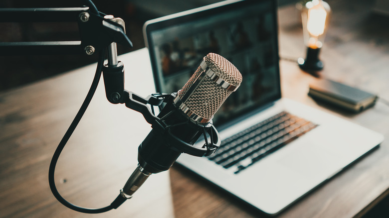 podcast microphone next to computer