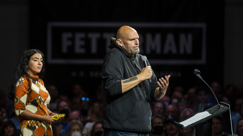 Gisele Barreto Fetterman standing behind John Fetterman