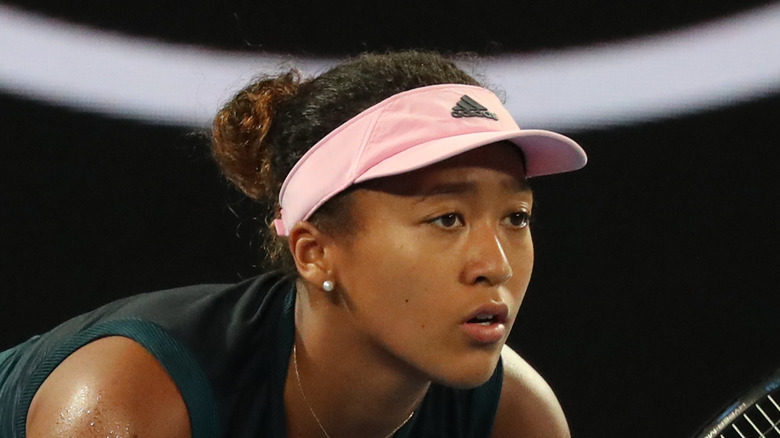 Naomi Osaka preparing to hit the ball
