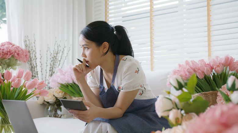 Anxious woman calculating finances