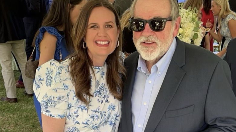 Sarah Huckabee Sanders posing next to her dad, Mike Huckabee