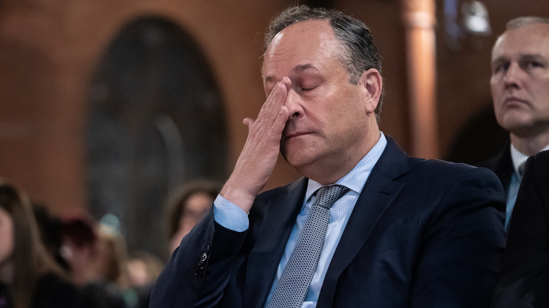 Doug Emhoff, husband of Vice President Kamala Harris, reacts as gun violence survivors speak during a national vigil on December 6, 2023 in Washington, DC.