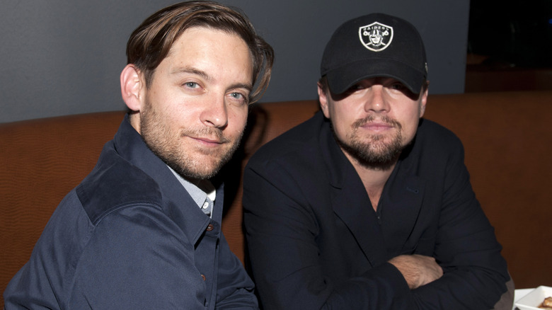 Leonardo DiCaprio and Tobey Maguire posing for photos together
