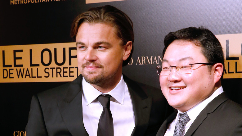 Leonardo DiCaprio and Jho Low smiling for photos in suits