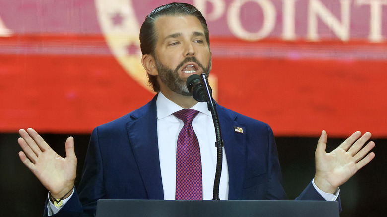 Donald Trump Jr. delivering a speech while gesturing with his hands