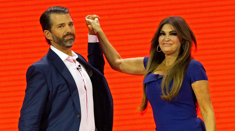 Donald Trump Jr. and Kimberly Guilfoyle caught in an awkward victory stance