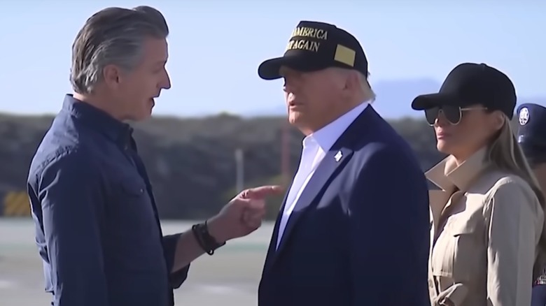 Gavin Newsom speaking to Donald Trump while Melania Trump watches