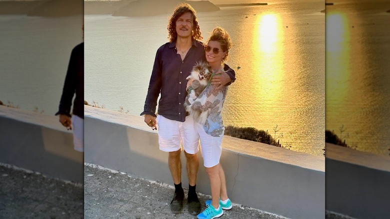 Frédéric Thiébaud and Shania Twain pose with their dog in Greece