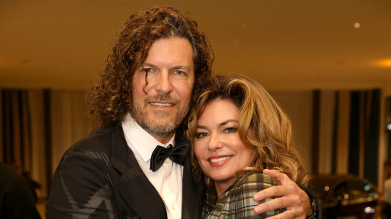 Frédéric Thiébaud and Shania Twain hugging and smiling