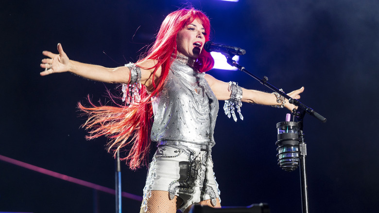 Shania Twain performs with red hair