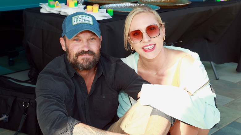 Brian Austsin Green and Sharna Burgess pose for a photo. 