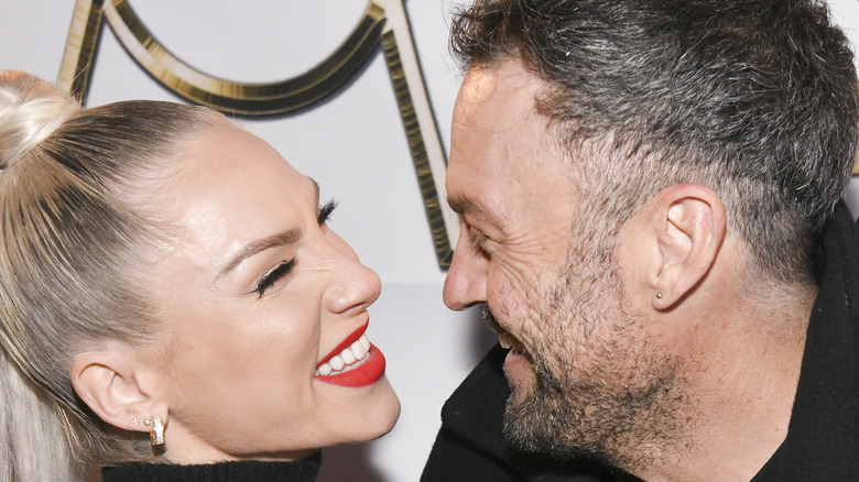 Brian Austin Green and Sharna Burgess at an event. 