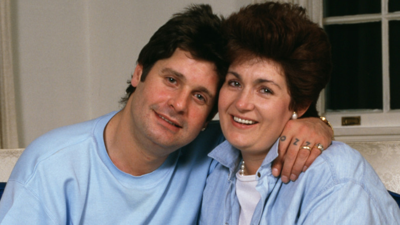 Ozzy Osbourne and Sharon Osbourne smile while posing for family photos in 1987 (1987)