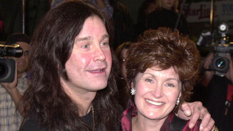 Singer Ozzy Osbourne and wife Sharon Osbourne pose for photographers at the premiere of New Line's "Little Nicky" on November 2, 2000 at Mann's Chinese Theatre in Hollywood, California (2000)