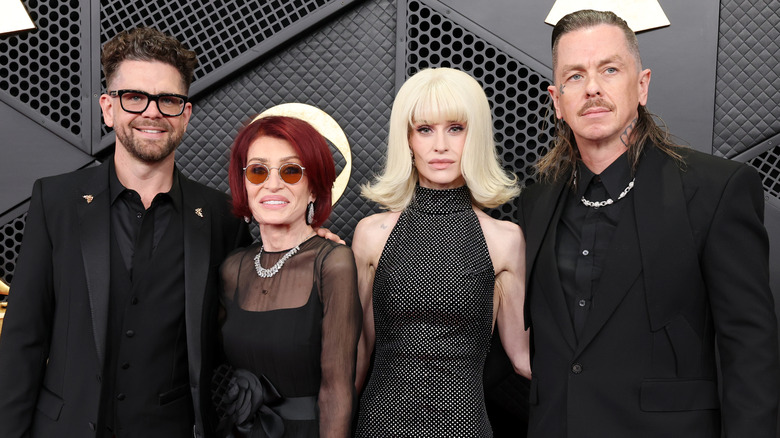 Sharon and Kelly Osbourne posing with Sid Wilson