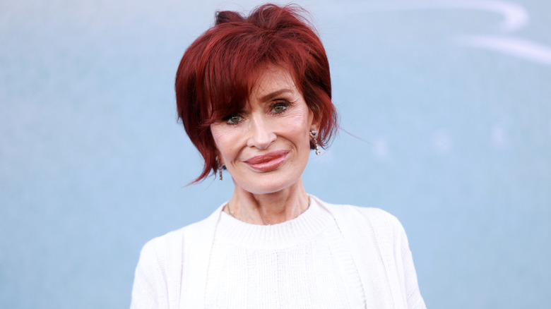 Sharon Osbourne smiling slightly