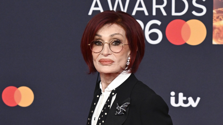 Sharon Osbourne wearing glasses while photographed on the red carpet at the Brit Awards