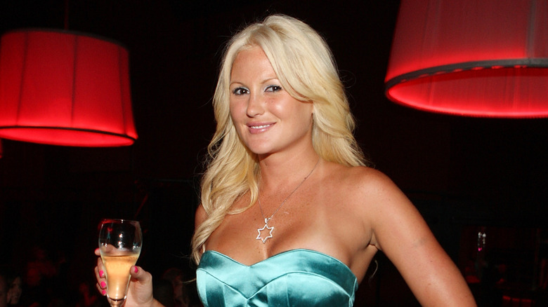 Megan Hauserman holding a glass of wine