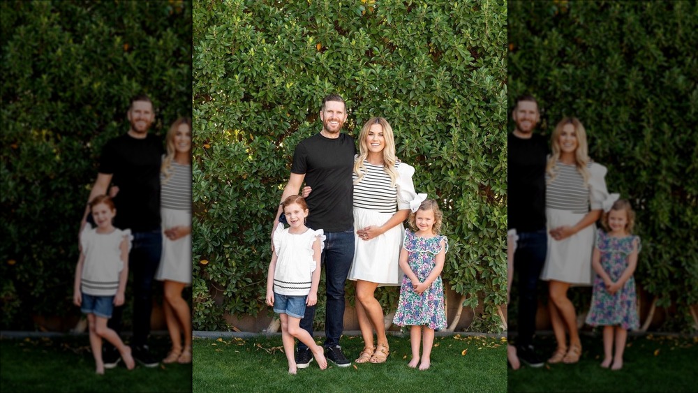 The McGee family poses announcing pregnancy