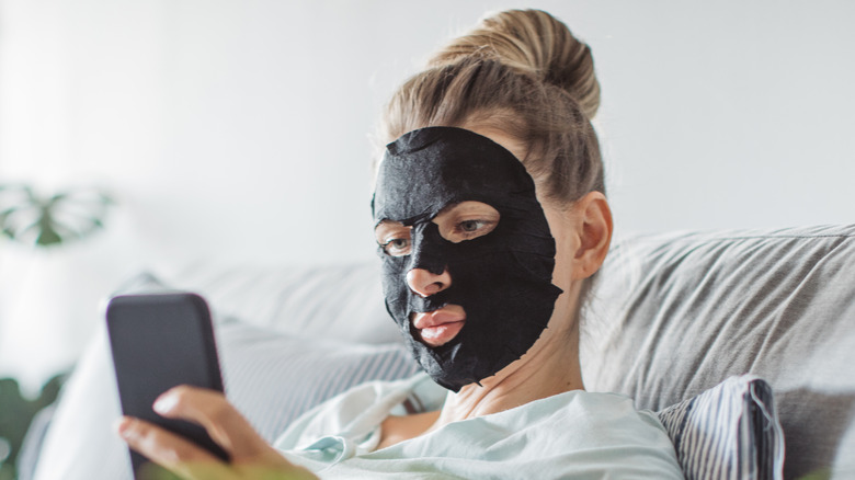 Woman wearing sheet mask