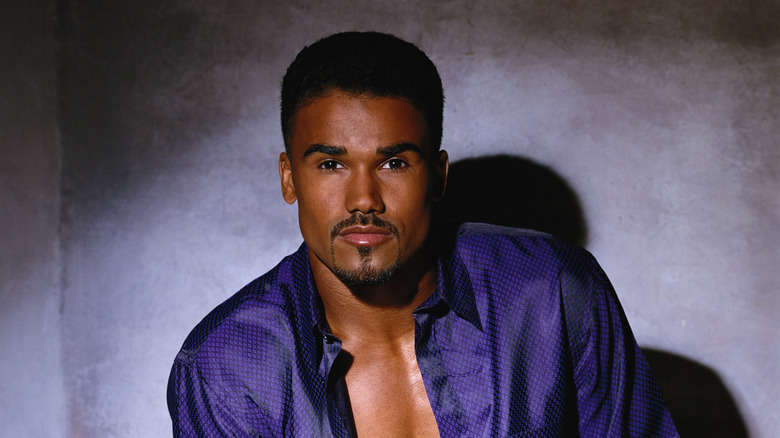 Shot of Shemar Moore modeling in a purple shirt