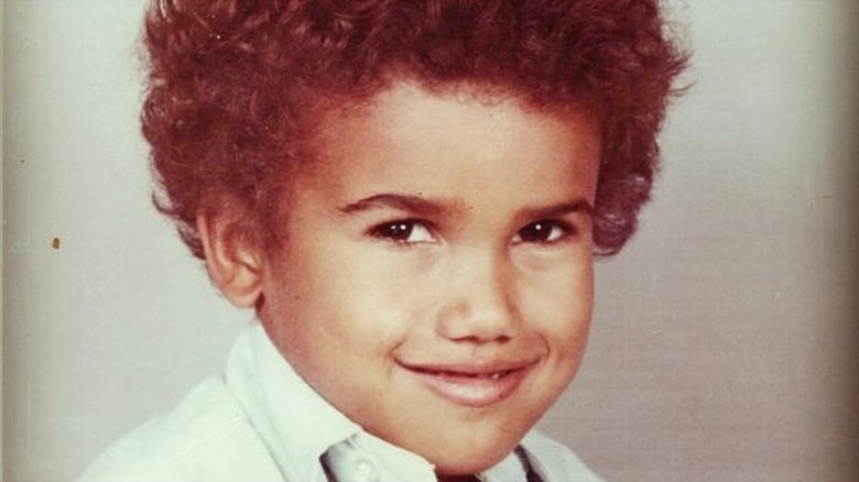 Close up of Shemar Moore as a child smiling for a photo