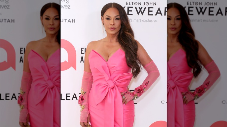 Sheree Zampino attending an Elton John charity event in a pink gown.
